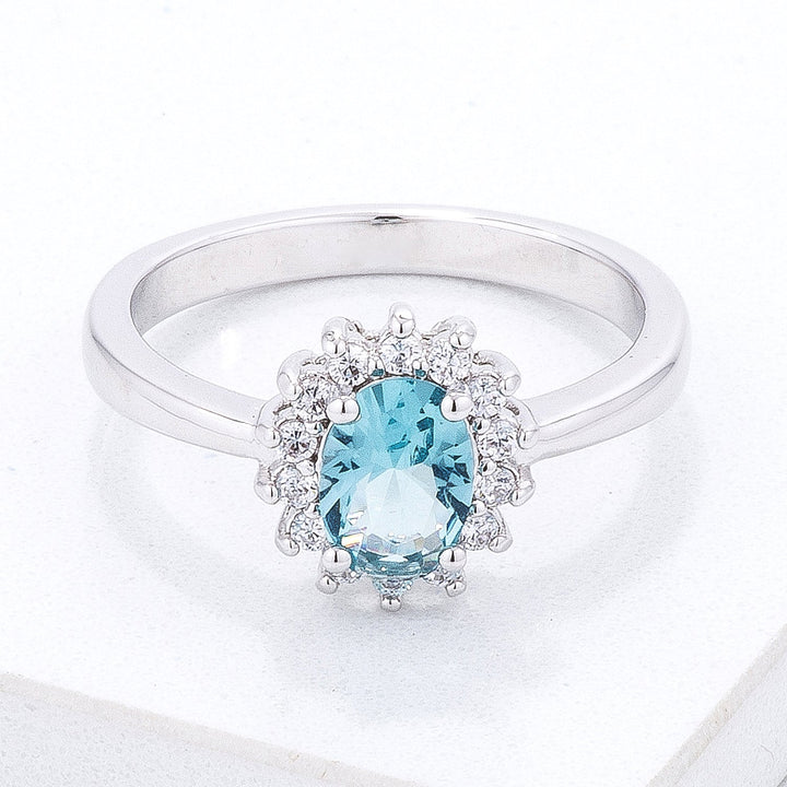 LOVCIA Elegant Silvertone Oval Cut Ice Blue CZ Ring