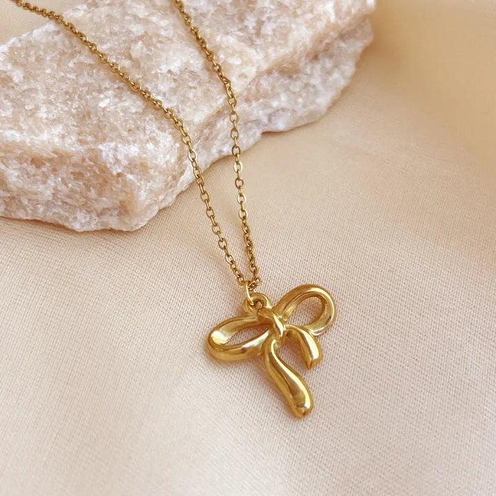 LOVCIA Gold Plated Stainless Steel Bow Knot Pendant Necklace for Women - Elegant and Minimalist Design LOVCIA