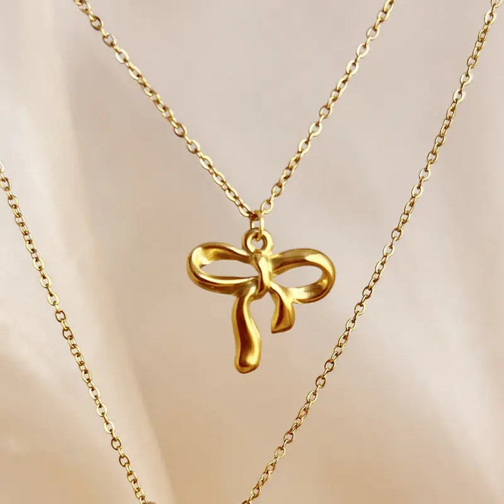 LOVCIA Gold Plated Stainless Steel Bow Knot Pendant Necklace for Women - Elegant and Minimalist Design LOVCIA