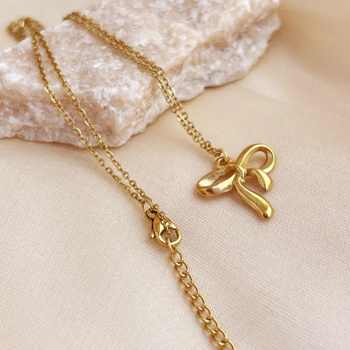 LOVCIA Gold Plated Stainless Steel Bow Knot Pendant Necklace for Women - Elegant and Minimalist Design LOVCIA