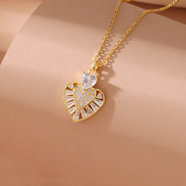 LOVCIA Gold Plated Sterling Silver Heart Pendant Necklace for Women With Pavé and Baguette-Cut Crystal Design LOVCIA