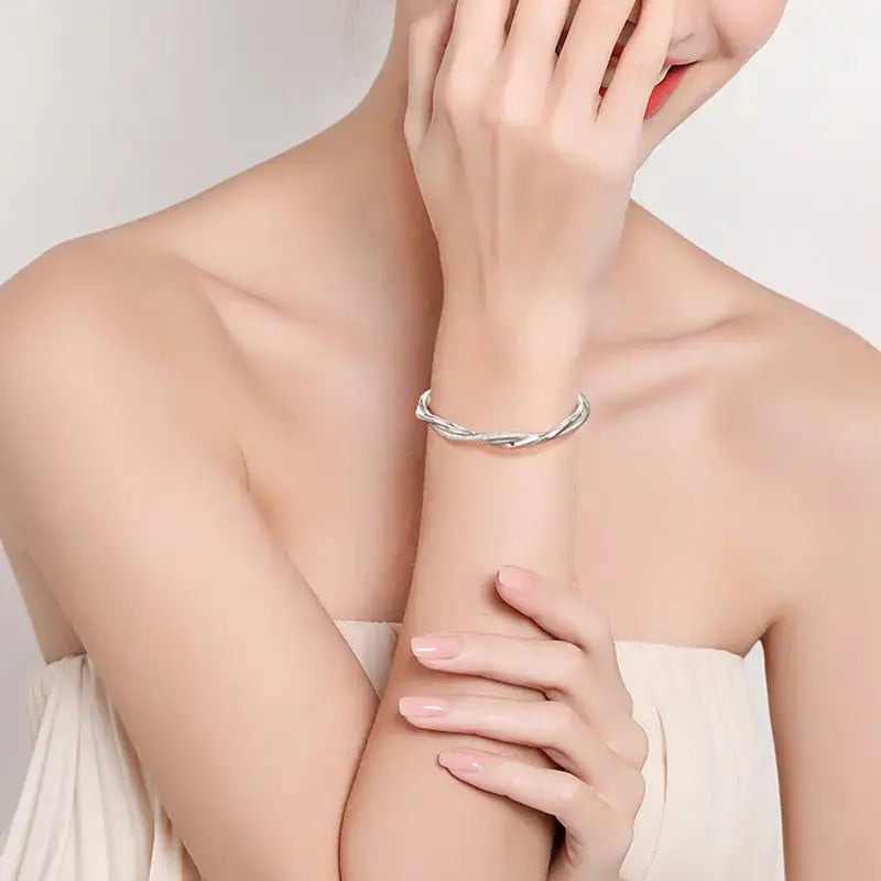 Lovcia Women's Twisted Silver Bangle Bracelet - Modern and Stylish Fashion Jewellery-Bracelets-Bow with Dangling Ball Bangle-Bow with Dangling Ball Bangle