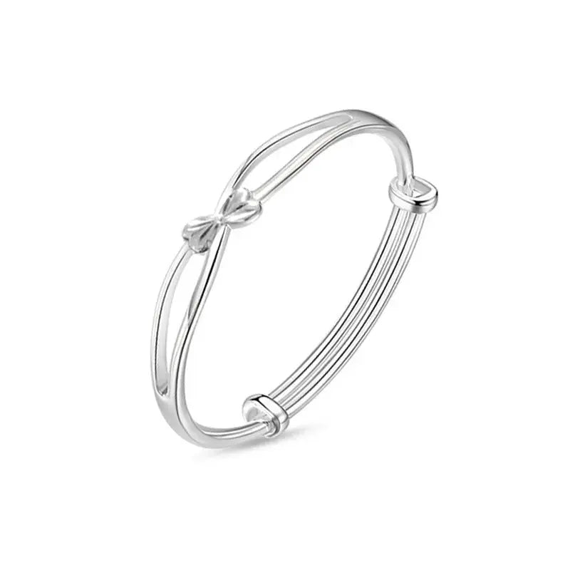 Lovcia Women's Twisted Silver Bangle Bracelet - Modern and Stylish Fashion Jewellery-Bracelets-Bow with Dangling Ball Bangle-Bow with Dangling Ball Bangle